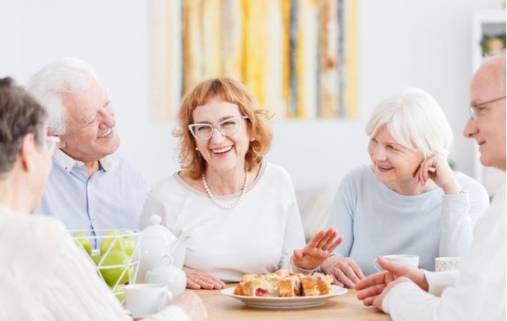 A group of seniors socializing and having fun in their independent living community